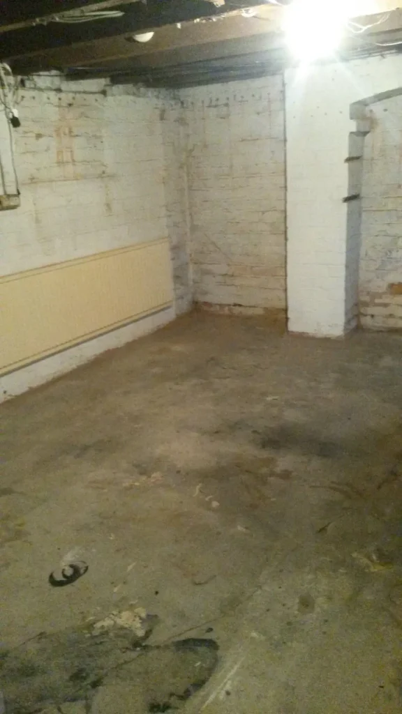 Cellar Conversion Front Lounge Pre-Conversion Photo in Manchester