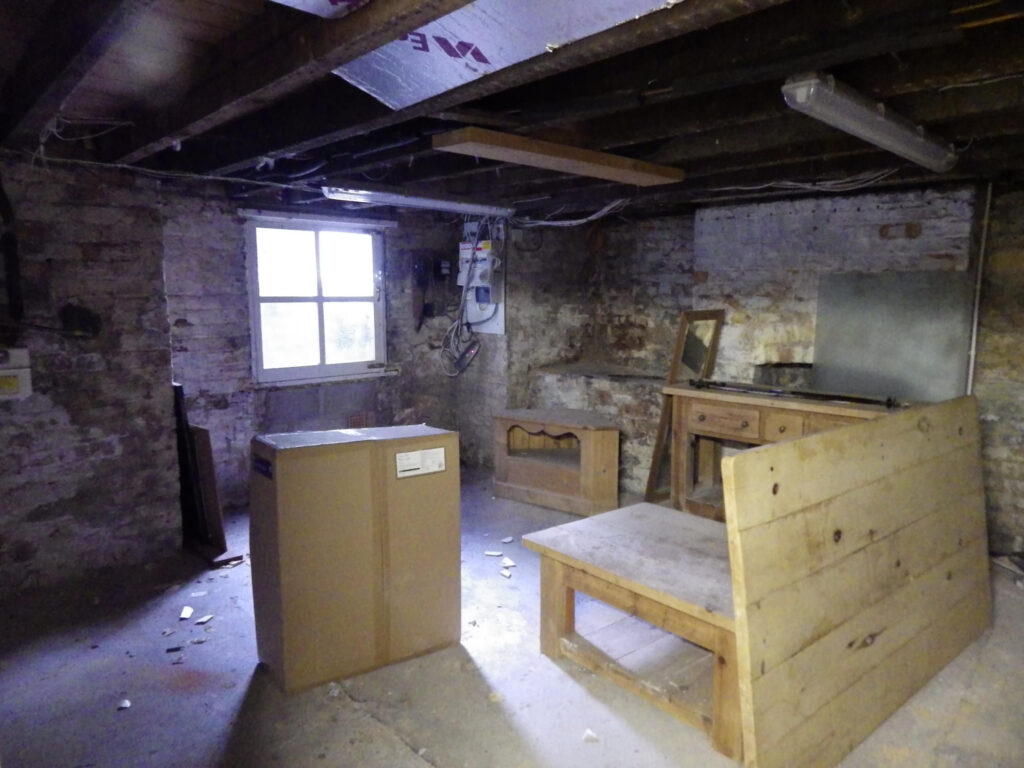 Cellar Conversion Lounge Before Photo in Manchester
